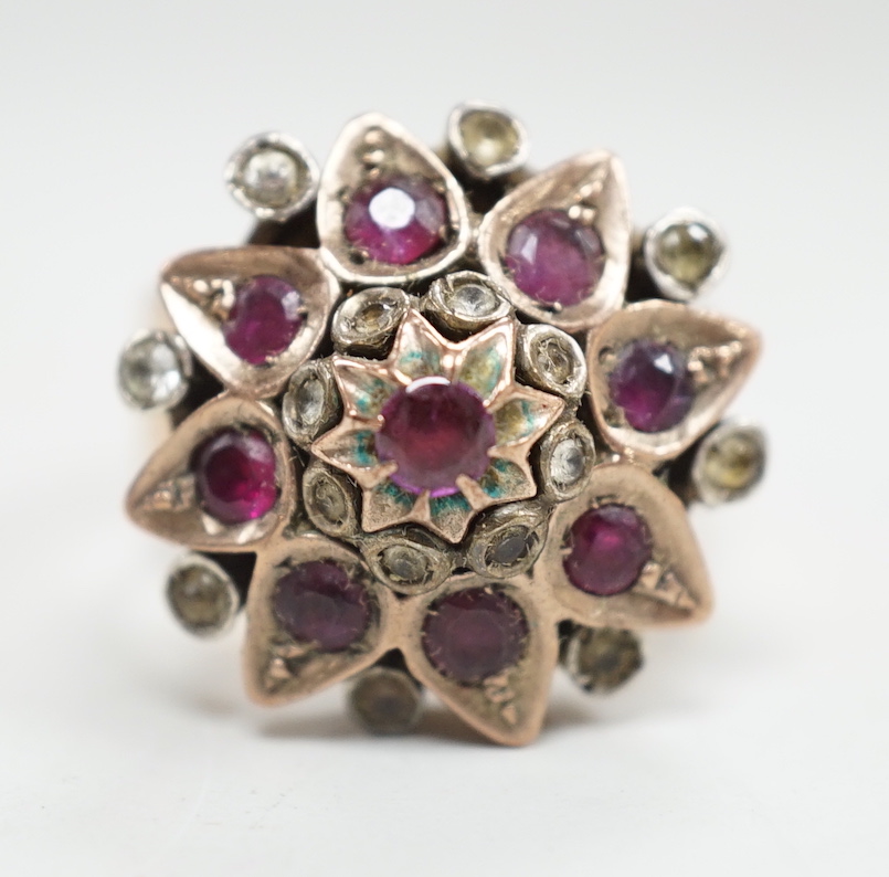 An antique yellow metal and two colour paste set cluster dress ring, size O, gross weight 10.8 grams.